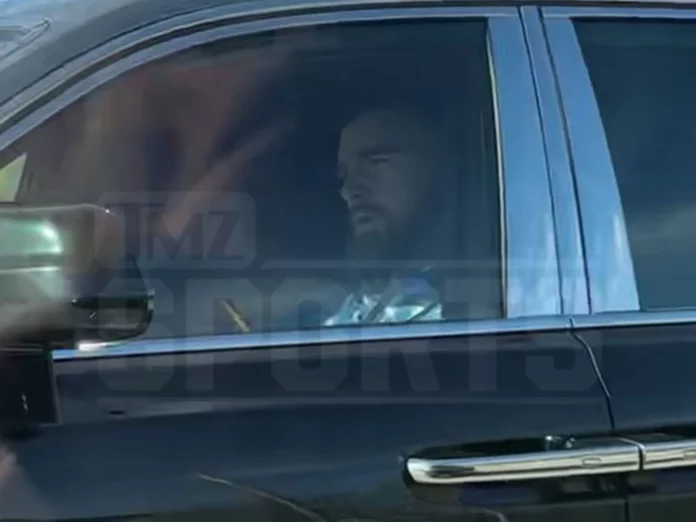 Travis Kelce is spotted SINGING in his Rolls Royce as he drives around Kansas City alone on Thanksgiving... after joking he'd spend the day eating KFC as lover Taylor Swift tours in Brazil