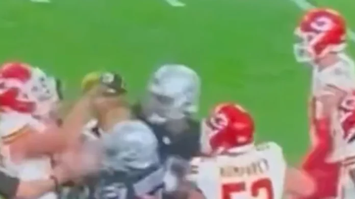 Travis Kelce gets into a scuffle during the Chiefs' win over the Raiders as Taylor Swift fans are left in awe of the Kansas City star: 'He CAN fight'
